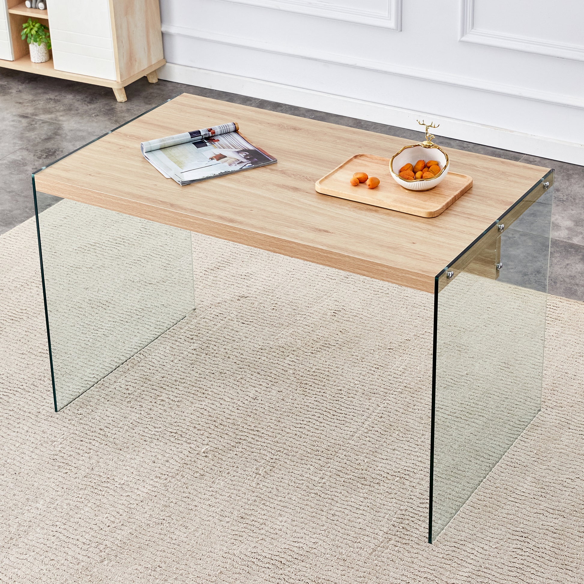 The top of the coffee table is made of medium density fiberboard and wooden stickers, with transparent tempered glass on both sides. The design is simple and elegant, with a sturdy structure.