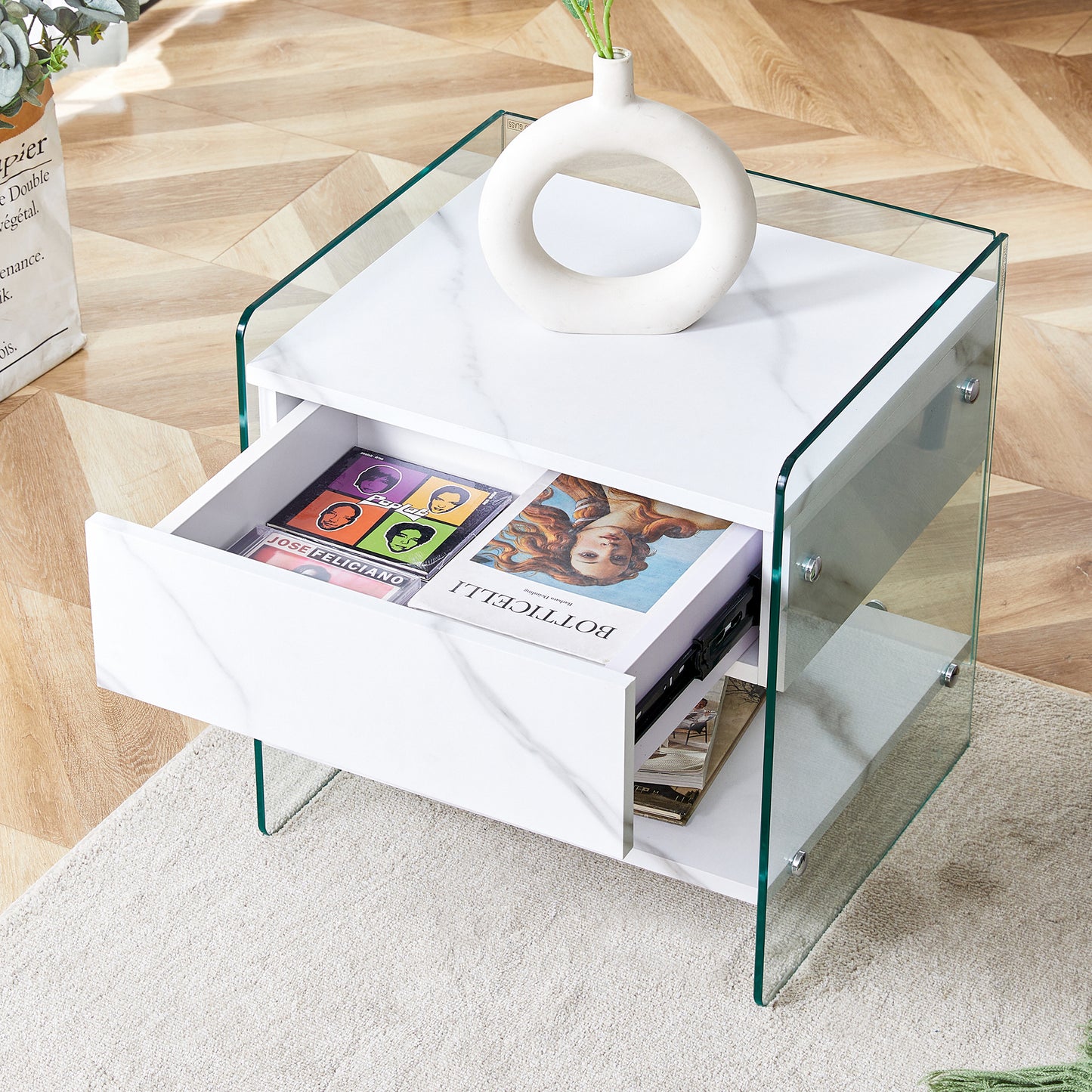 Bedside table with drawers. The board surface is MDF sticker, and both sides are transparent tempered glass. The design is simple and elegant, with excellent storage functions.