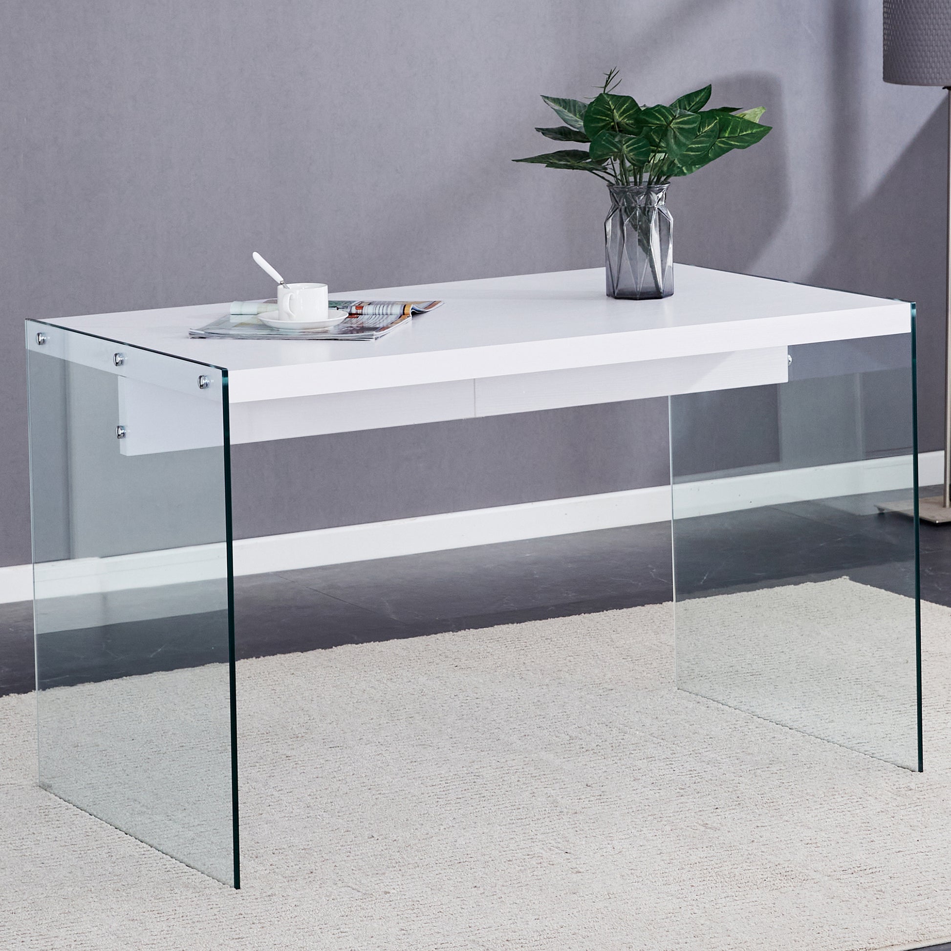 The top of the coffee table is made of MDF and white stickers, and the sides are clear tempered glass. The design is simple and elegant, and the structure is strong.