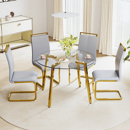 Table and chair set.Modern Luxurious Round Tempered Glass Dining Table Set-40*40 inch with 4 Light Gray PU Chairs.C-tube Gold Metal Chair Legs.Bring a comfortable home experience to the kitchen.