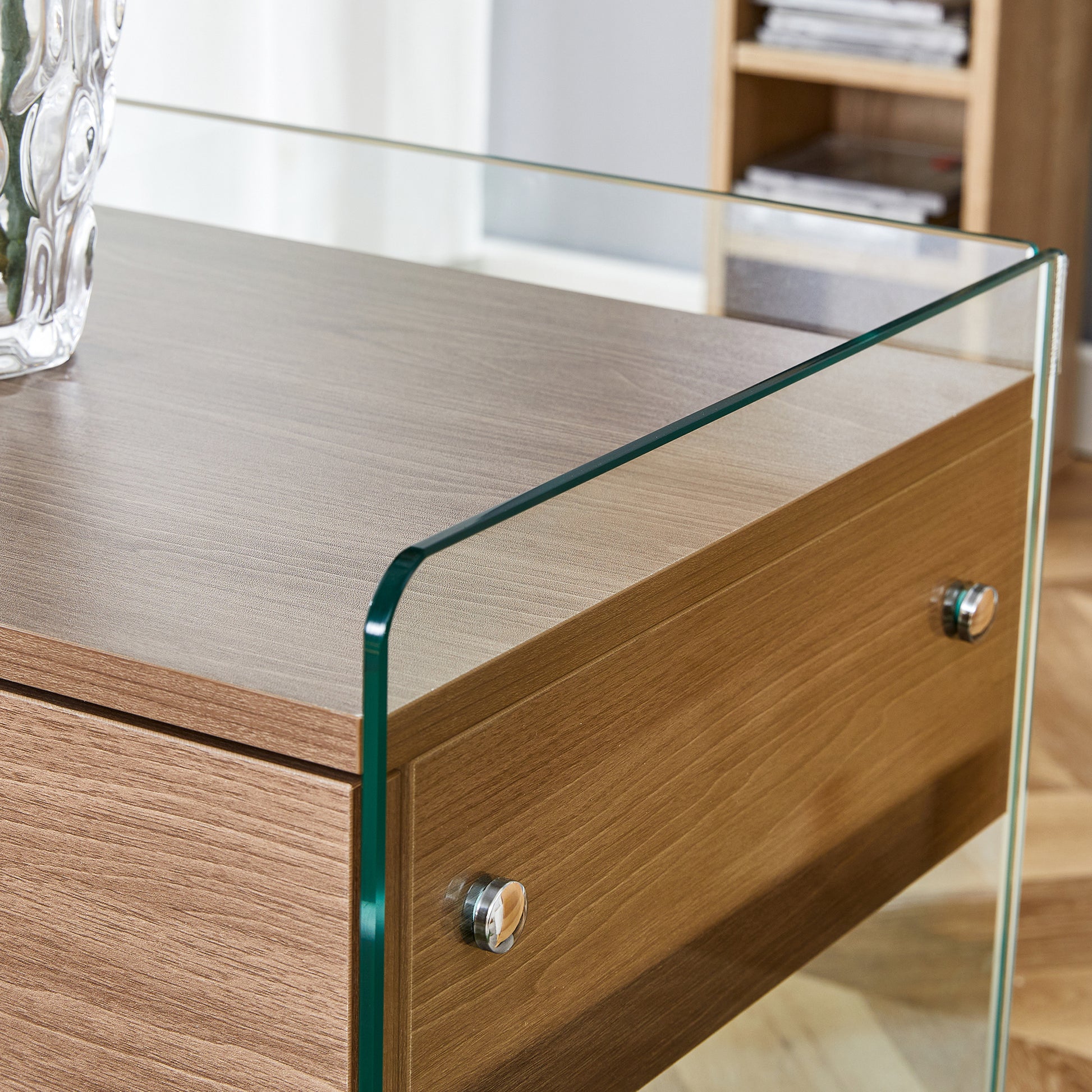 Bedside table with drawers. The board surface is MDF sticker, and both sides are transparent tempered glass. The design is simple and elegant, with excellent storage functions.