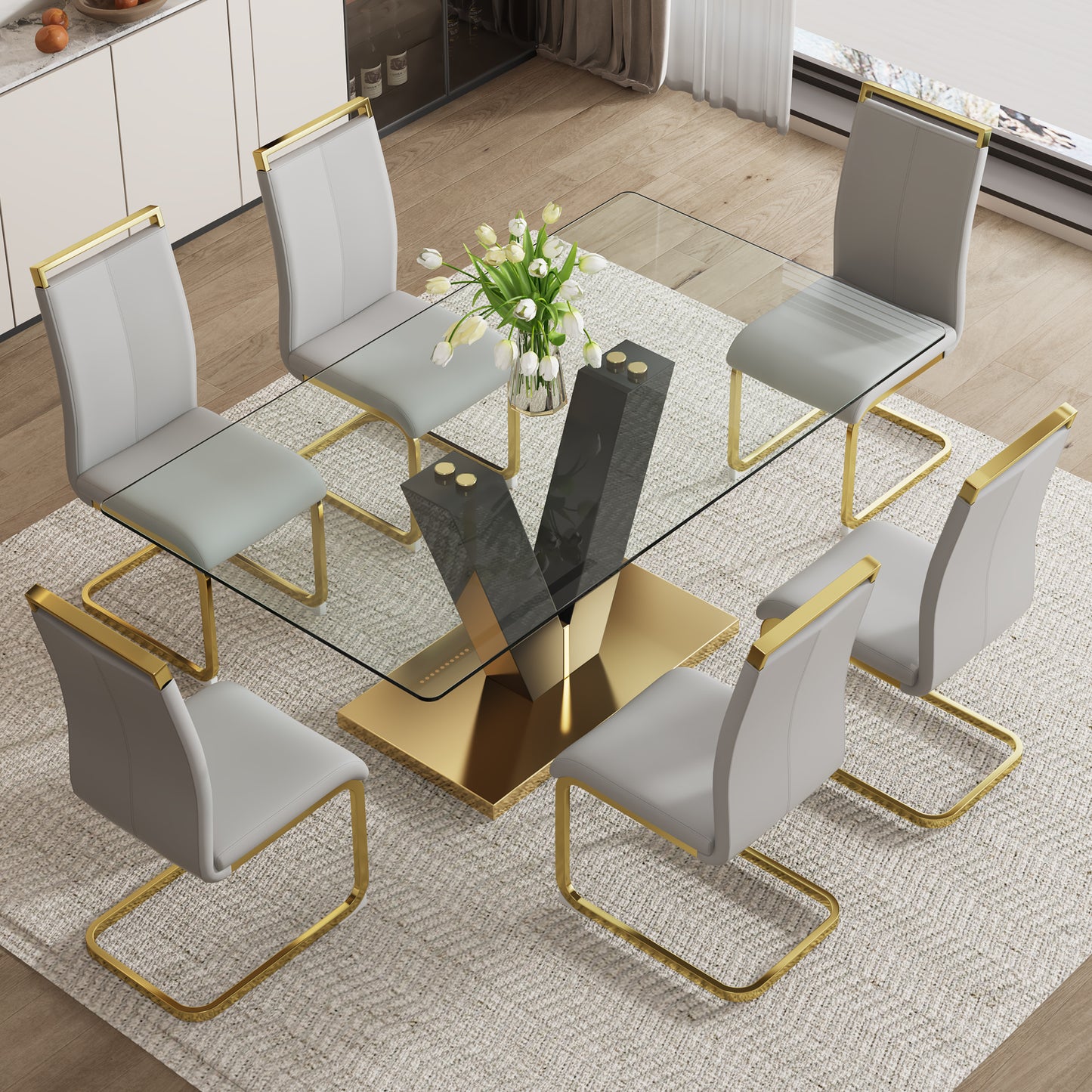 Table and chair set.Subtle Luxury Clear Tempered Glass Dining Set - 71"x35.4" with 6 Light Gray PU Chairs.C-tube Gold Metal Chair Legs.Bring a comfortable home experience to the kitchen, bedroom.