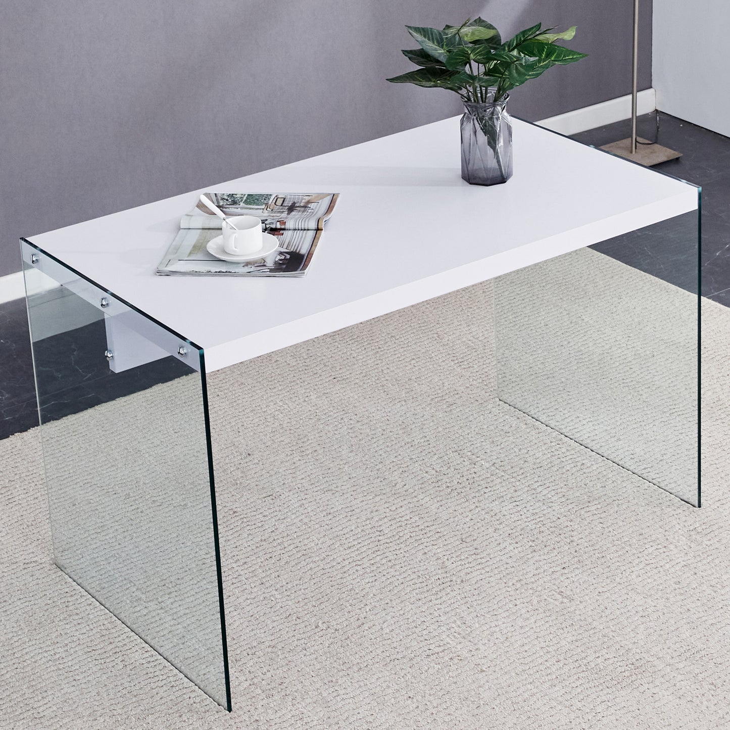 The top of the coffee table is made of MDF and white stickers, and the sides are clear tempered glass. The design is simple and elegant, and the structure is strong.