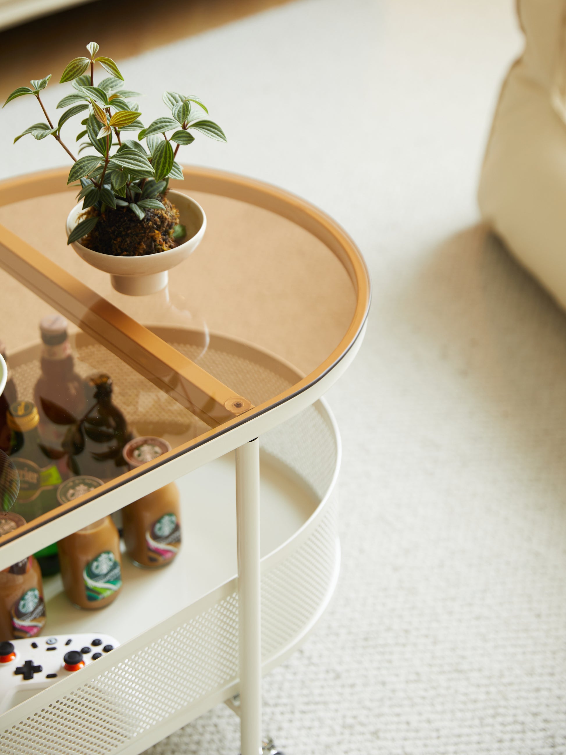 Movable oval metal glass coffee table with storage