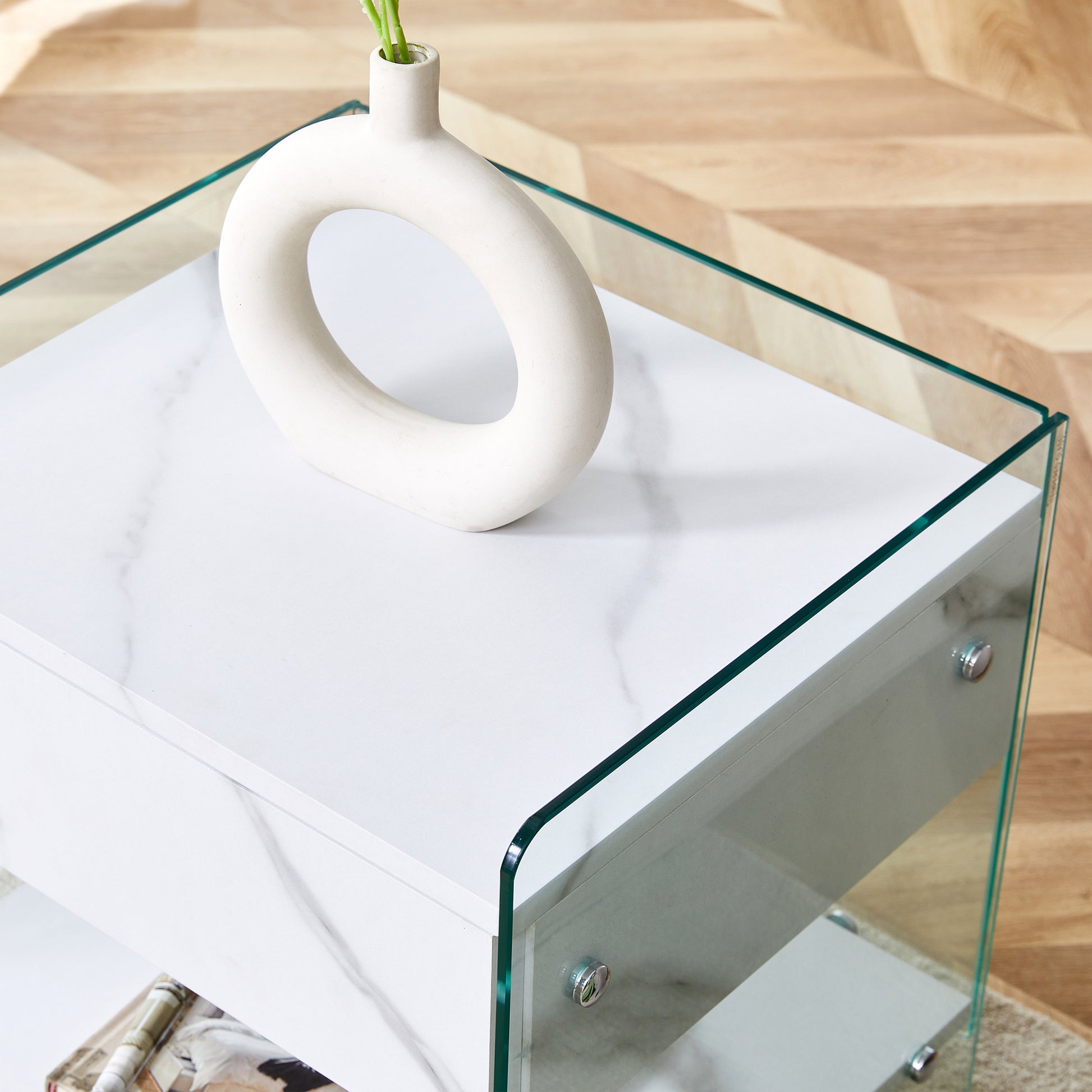 Bedside table with drawers. The board surface is MDF sticker, and both sides are transparent tempered glass. The design is simple and elegant, with excellent storage functions.