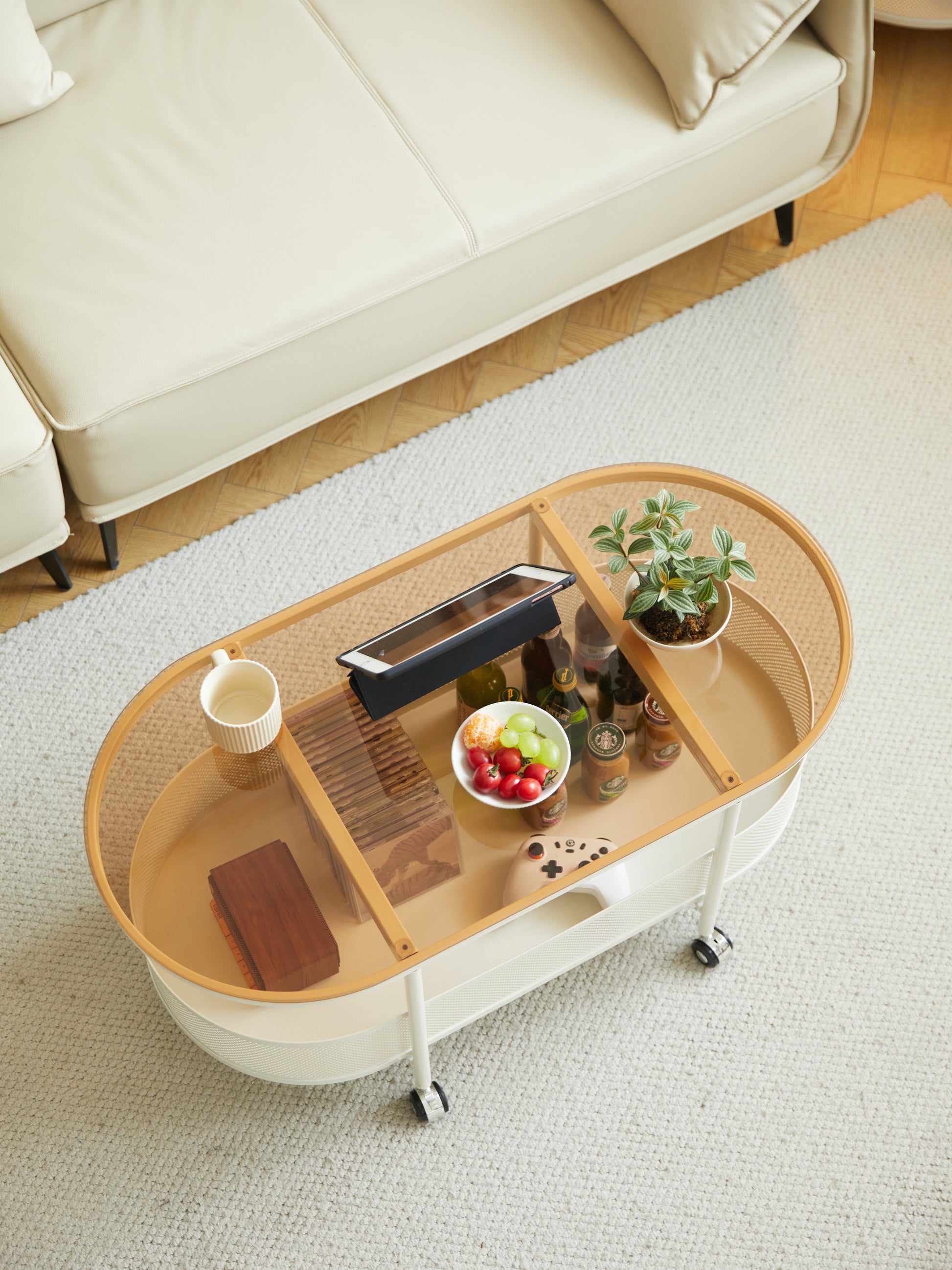 Movable oval metal glass coffee table with storage