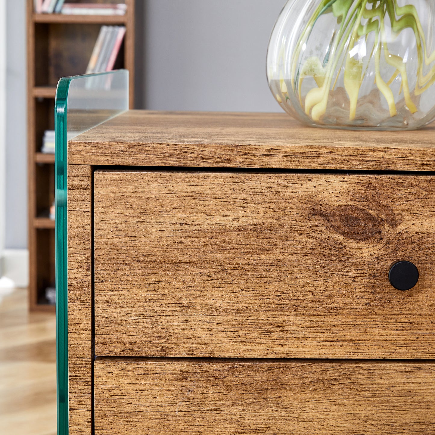 Double-drawer bedside table. The board surface is MDF sticker, and both sides are transparent tempered glass. The design is simple and elegant, with excellent storage functions.