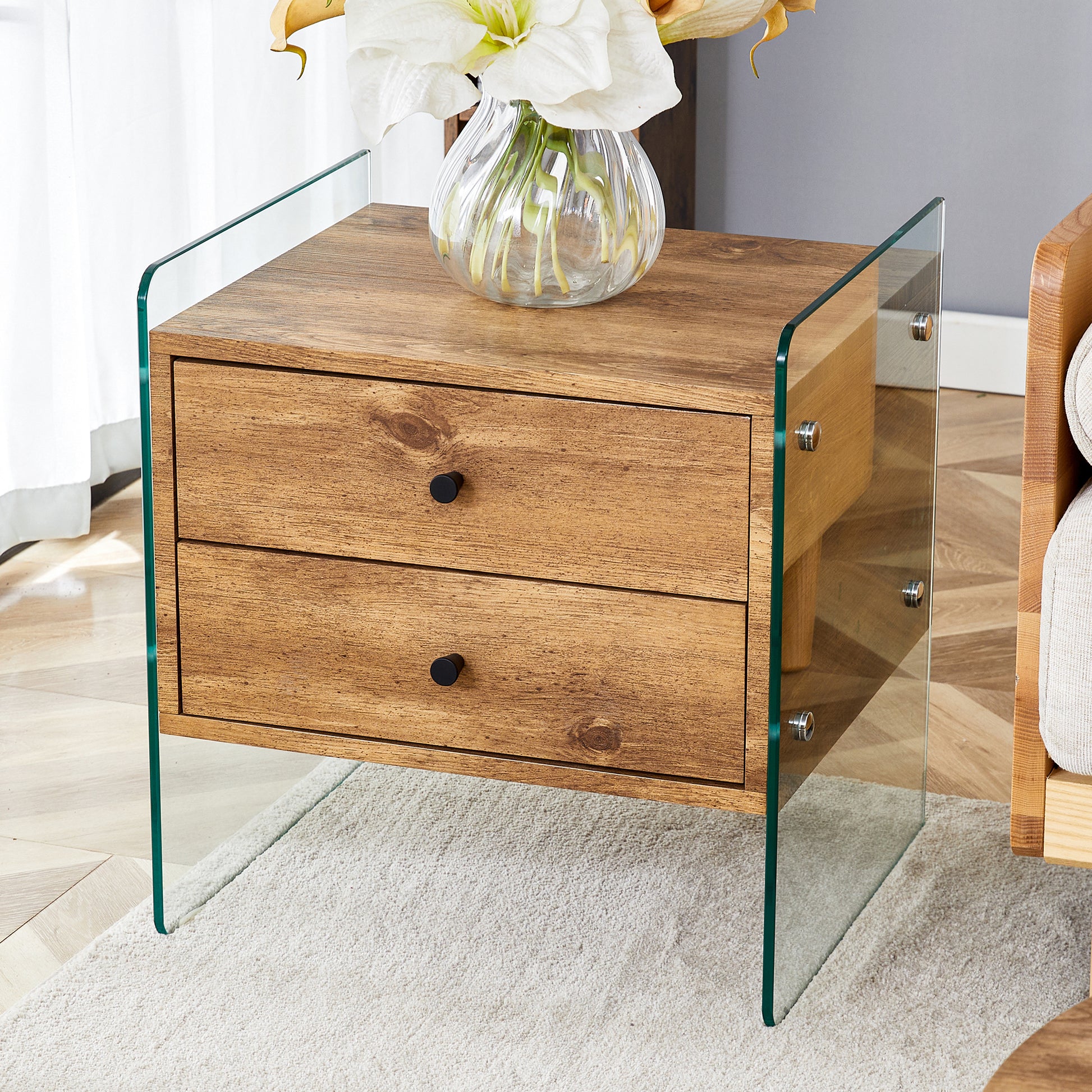 Double-drawer bedside table. The board surface is MDF sticker, and both sides are transparent tempered glass. The design is simple and elegant, with excellent storage functions.