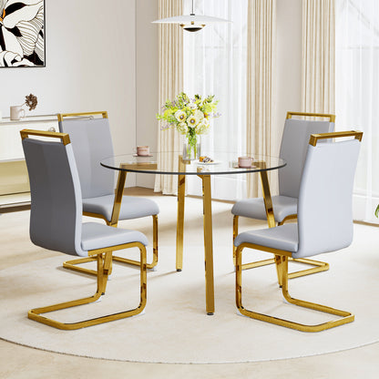 Table and chair set.Modern Luxurious Round Tempered Glass Dining Table Set-40*40 inch with 4 Light Gray PU Chairs.C-tube Gold Metal Chair Legs.Bring a comfortable home experience to the kitchen.