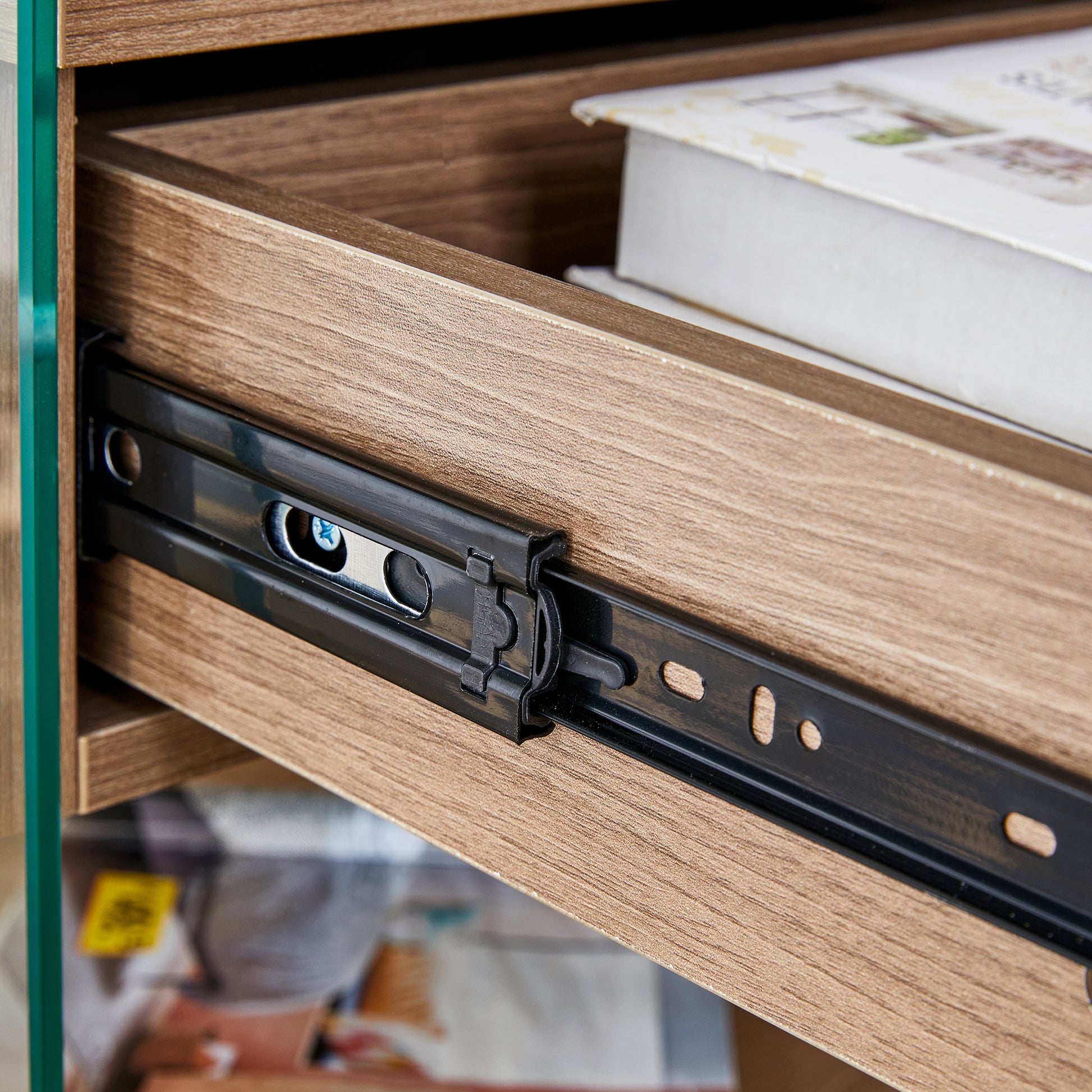 Bedside table with drawers. The board surface is MDF sticker, and both sides are transparent tempered glass. The design is simple and elegant, with excellent storage functions.